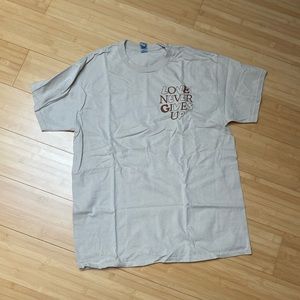 WWJD He Would Love First Love Never Gives Up Brown Tee